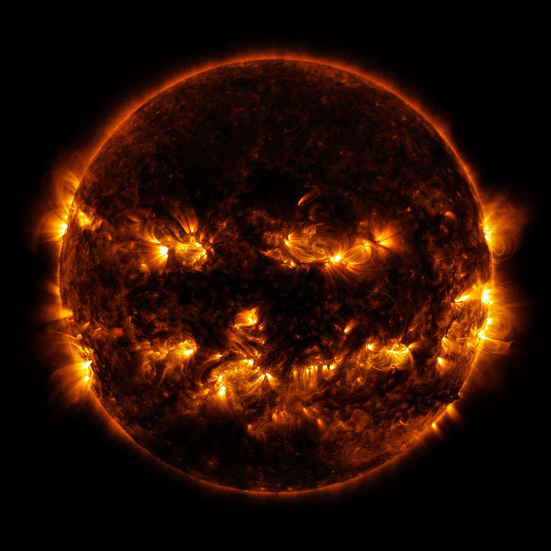 active-regions-on-the-sun-combine-to-look-something-like-a-jack-o-lanterns-face-as-pictured-in-this-image-provided-by-nasa-on-october-8-2014