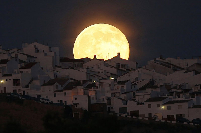 another-image-of-the-supermoon-this-one-as-it-rises-over-houses-in-olvera-in-the-southern-spanish-province-of-cadiz-on-july-12-2014-was-a-popular-image-on-reuters-instagram